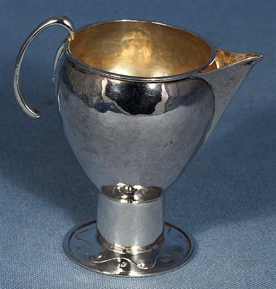 An Edwardian Arts & Crafts silver sparrow beak cream jug, Height 3 ¾”/90mm Weight 2.8oz/80grms